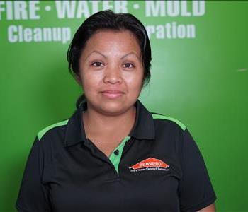 Woman in front of SERVPRO logo
