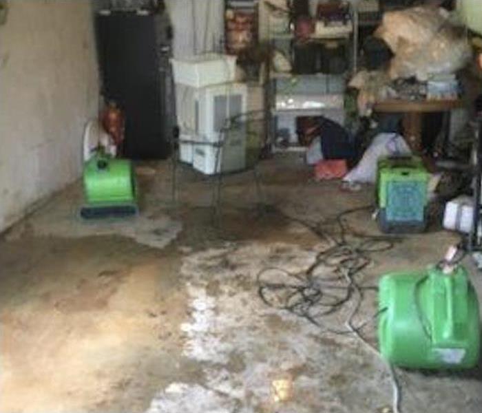 two air movers placed in a basement
